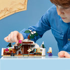 LEGO - One Piece Le repaire du docteur Hiluluk-Les détails incluent une table remplie d’expériences, des livres et un drapeau de pirate