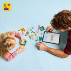 LEGO - Bluey Le terrain de jeu de Bluey et Chloe, Ensemble de construction préscolaire -De nombreuses façons de jouer - Il y a une figurine de pélican rotative sur laquelle monter, 3 plantes sur lesquelles les personnages peuvent sauter, une tour avec un télescope et une aire de pique-nique avec des boissons et des gâteaux