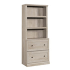 Sauder - Bibliothèque avec tiroirs - Châtaignier crayeux-Rangement multi-pièces: cette bibliothèque fonctionnelle à tiroirs peut répondre à vos besoins de rangement dans différentes pièces: salon, buanderie, cuisine, atelier ou salle de bain