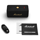 Marshall - Emberton II Enceinte Bluetooth portable - Noir et Laiton-Fidèle au design emblématique de la marque, tout en adoptant une approche plus durable. Cette enceinte à la conception robuste est composée à 50 % de plastique recyclé post-consommation issu d'appareils électroniques, de bouteilles d'eau et de protections de phares de voiture, le tout sans PVC
