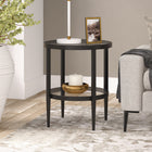 Hudson&Canal - Table d'appoint ronde Hera de 50 cm de largeur avec étagère en verre, - Bronze noirci-Une finition artisanale est appliquée sur le cadre en acier