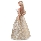 Mattel - Poupée Barbie Joyeux Noël 2025 - blonde avec une robe argent et or-La robe se distingue par une jupe ample et volumineuse avec un col sans bretelles à volants, tandis que ses boucles d'oreilles dorées ajoutent plus d'élégance de vacances !
