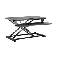 Uplite Convertisseur de Bureau Assis debout - Noir-Solution Ergonomique - Ce bureau debout se trouve au-dessus de votre bureau actuel, vous permettant de vous asseoir ou de vous tenir debout sur demande.