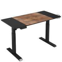 LjubLjana - Bureau assis-debout à hauteur réglable électrique de 53 po - Bois/Noir-Conception robuste en 4 parties - Cette table peu encombrante de 53,5 po x 23,6 po s'intégrera facilement dans votre espace de bureau tout en offrant suffisamment d'espace pour une variété de configurations de moniteurs et d'ordinateurs portables ainsi que des matériaux de travail importants, des fournitures, et décor