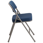 Chaise pliante Premium de la série HERCULES en métal et tissu marine à triple entretoise courbé et double charnière-Rembourrage en tissu marine