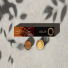 Delta Q - Capsules Espresso à la cannelle, paquet de 10-Ces capsules de café à la cannelle vous emmènent dans un voyage aux saveurs d'épices douces. Cet Espresso équilibré de DeltaQ mêle des notes de cannelle, de noisettes et de fruits à coque grillés pour un café aromatique et légèrement acidulé.