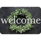 Ashley Productions - The Original Fun Mat - Tapis de Bienvenue - 15 -5" x 23 -5" - Couronne d'ardoise de Bienvenue-Mesure et design : Le paillasson de bienvenue en forme de couronne de laurier mesure 15,5 po x 23,5 po.