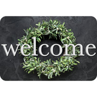 Ashley Productions - The Original Fun Mat - Tapis de Bienvenue - 15 -5" x 23 -5" - Couronne d'ardoise de Bienvenue-Mesure et design : Le paillasson de bienvenue en forme de couronne de laurier mesure 15,5 po x 23,5 po.