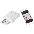 Canon - Imprimante photo couleur SELPHY Square QX10, blanc-Il suffit de connecter votre appareil à lâ™application SELPHY PHOTO LAYOUT 2.0 de Canon pour laisser libre cours à votre créativité avec des filtres amusants, dâ™autocollants et plus encore