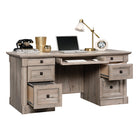 Sauder 65"W La Collection Palladia Bureau Ministre - Finition Split Oak-  Le système de gestion des cordons comprend également deux œillets de bureau, de nombreux passe-câbles et un socle avec panneau à charnières pour un accès facile