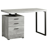Monarch Specialties - 7409 Bureau 48 po L - Faux Bois Gris/Metal Noir-Un bureau d'ordinateur moderne de 48 pouces de long dans un style moderne, avec une configuration réversible pour une installation à gauche ou à droite, parfait pour créer un espace de travail fonctionnel dans votre bureau à domicile.