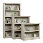 Sauder - Bibliothèque de rangement divers à 3 tablettes, 423032, fini châtaignier blanchi-La surface supérieure peut supporter jusqu'à 15 lb ; deux tablettes centrales peuvent supporter jusqu'à 25 lb chacune ; la tablette inférieure de base peut supporter jusqu'à 50 lb.